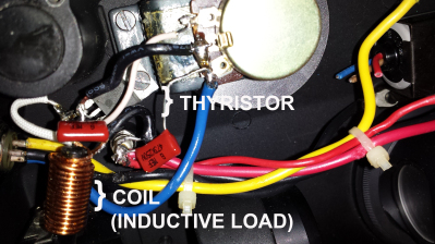 Dimmer components installed on Nikon potentiometer. Heat sink on the thyristor, the barely-visible black
chip, is secured under one potentiometer mounting screw.